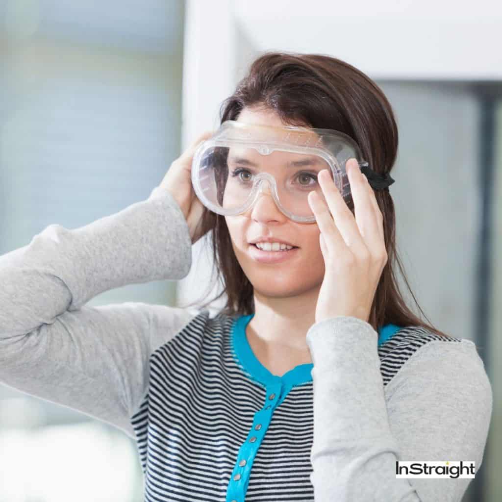 lady wearing lab googles under title Why Does Keratin Burn My Eyes?